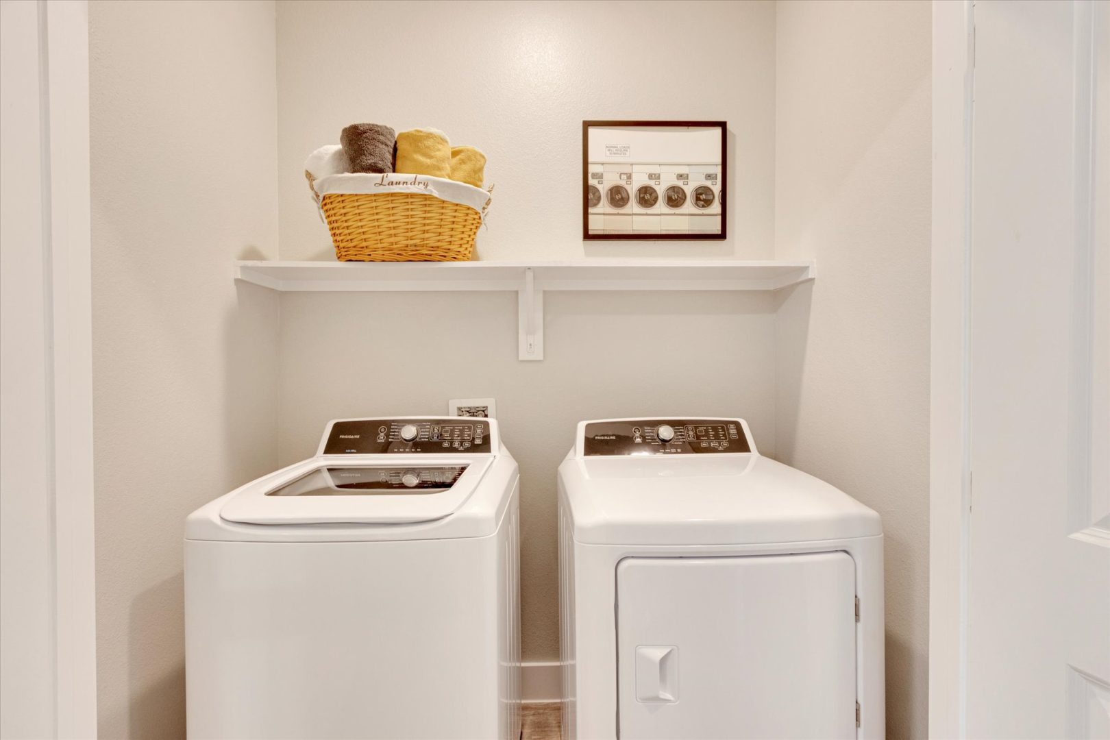 a laundry room with a washer and dryer at The Town Arlington