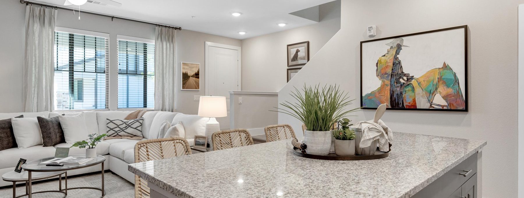 a clean and modern kitchen with granite counter tops at The Town Arlington