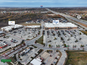 an aerial view of a parking lot and a shopping center at The Town Arlington