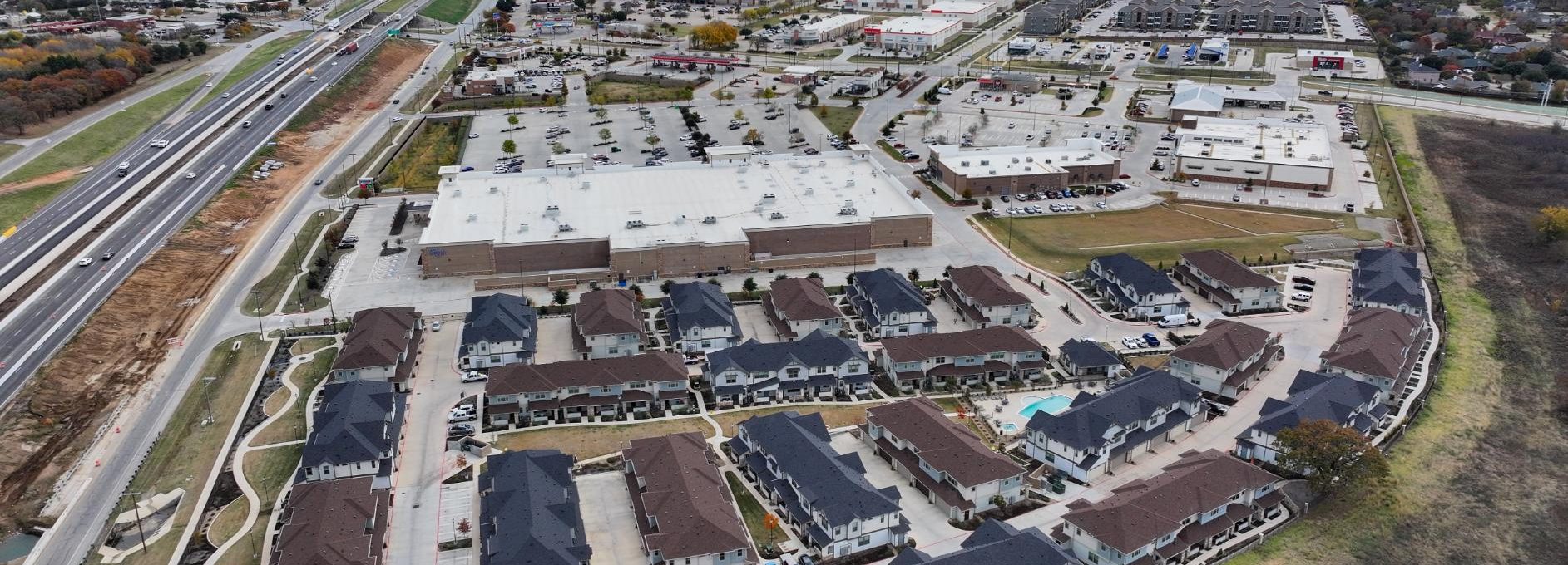 an aerial view of a residential area with a highway at The Town Arlington